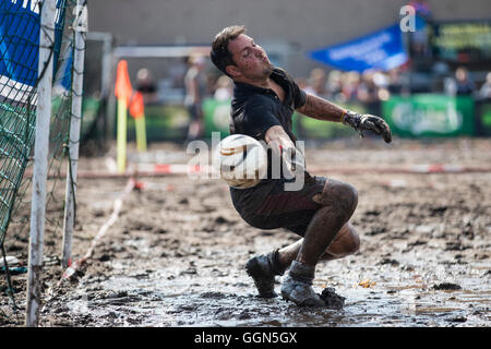 Woellnau, Germany. 06th Aug, 2016. Rene Schulze, goalkeeper for the Schenkenberger Schlammpen, in action at the German Championship in Mud Soccer in Woellnau, Germany, 06 August 2016. The winners of the playful championship qualify for the World Championship in Finland. Photo: ALEXANDER PRAUTZSCH/dpa/Alamy Live News Stock Photo