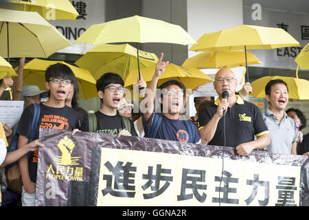 Hong Kong, Hong Kong S.A.R, China. 28th Aug, 2015. Legislative Council member Albert Chan Wai-yip speaks during a protest on the steps of Eastern Magistrates court before his court appearance. L to R Joshua Wong, Nathan Law, Wong Ho-ming Albert Chan.Student leader Joshua Wong Chi- Fung is before the court on charges of inciting and participating in an illegal assembly in 2014 which led to the ''Occupy Central'' pro-democracy movement know also as the Umbrella revolution © Jayne Russell/ZUMA Wire/Alamy Live News Stock Photo