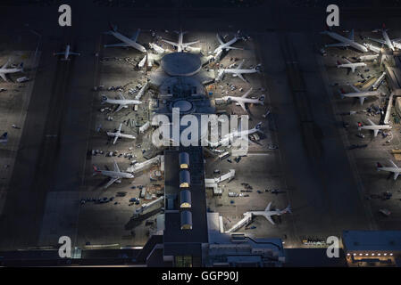 Aerial view of parked airplanes in the airport terminal. Modern and ...