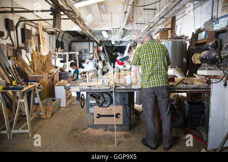 Father and daughter woodworking in workshop Stock Photo