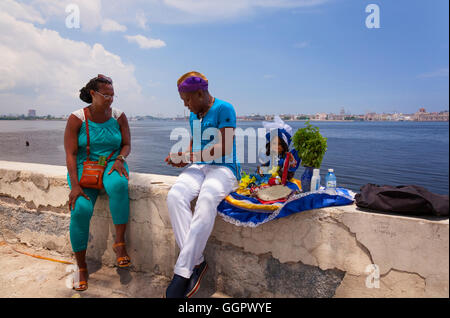 A tarot card reading by an Afro-Cuban, which is part of the Santeria religion. Regla, Havana, Cuba. Stock Photo