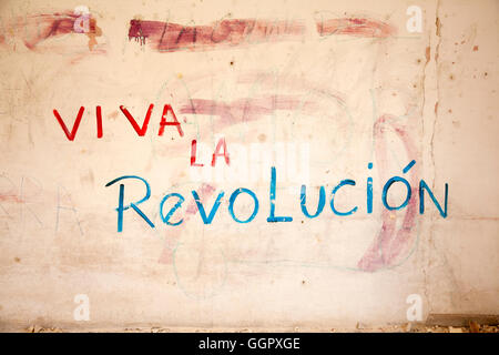 Graffiti on a wall that says Viva la Revolución (Live the Revolution). Regla, Havana, Cuba. Stock Photo