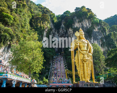 KUALA LUMPUR, MALAYSIA - MAR 1: Tourist and Lord Murugan Statue in front the batu cave entrance on March 1, 2016 in Kuala Lumpur Stock Photo