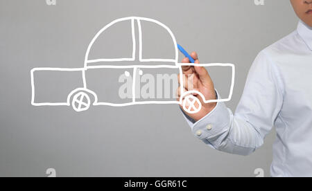 Hand of businessman drawing graphics a symbols geometric shapes of car and automotive to transportation concept in business and Stock Photo