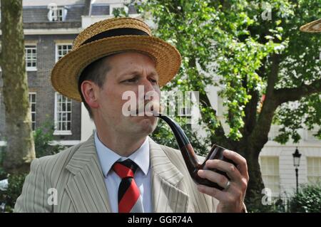 Smoking the pipe, at the start of the 2016 Chap Olympiad Stock Photo