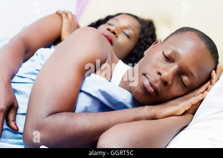 tired beautiful young loving  couples sleep deeply together in their bed Stock Photo
