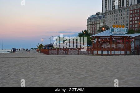 The café at Oak Street Beach in Chicago at sunset Stock Photo