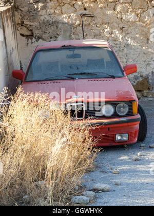 Photo of an old abandoned red car Stock Photo
