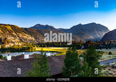Gull lake and Carson Peak as the sun sets in June Lake California Stock Photo