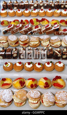 Assorted cakes on display Uk Stock Photo