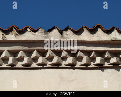 wall of Old Clock Tower at joint with roof opposite Ghazi Husrev- Bey Mosque or Gazi Husrev-beg Mosque in Sarajevo showing offset brickwork & pantiles Stock Photo
