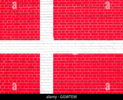 Flag of Denmark on brick wall texture background. Danish national flag. Stock Photo