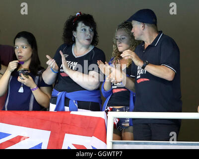 Mark and Caroline Peaty await the Men's 100m Final where their son will Adam will race for an Olympic medal on the second day of the Rio Olympics Games, Brazil. Stock Photo