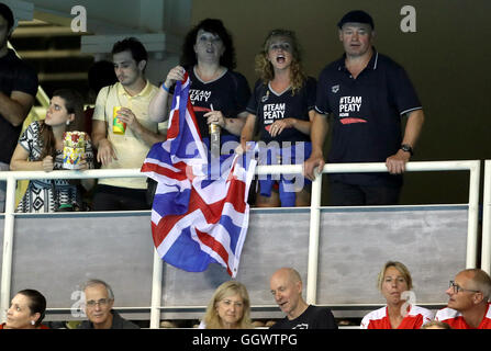 Mark and Caroline Peaty await the Men's 100m Final where their son will Adam will race for an Olympic medal on the second day of the Rio Olympics Games, Brazil. Stock Photo