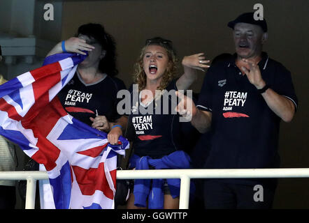 Mark and Caroline Peaty with Anna Zair (girlfriend of Adam Peaty) await the Men's 100m Final where their son will Adam will race for an Olympic medal on the second day of the Rio Olympics Games, Brazil. Stock Photo