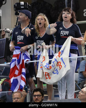 Mark and Caroline Peaty (left) with girlfriend Anna Zair in the BBC studio as they await the Men's 100m Final where their son will Adam will race for an Olympic medal on the second day of the Rio Olympics Games, Brazil. Stock Photo