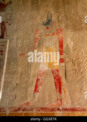 Wall relief of Anubus, the god of the dead in the Mortuary Temple of Hatshepsut on the West Bank at Luxor – Egypt. Stock Photo