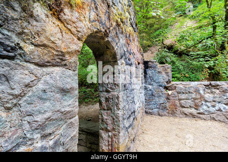 Abandoned stone castle house archway at Wildwood Trail in Forest Park Portland Oregon Stock Photo