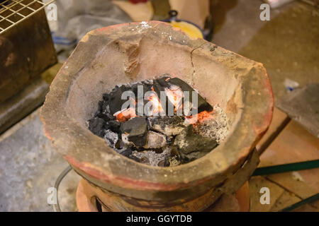 Old clay stove for traditional cooking in Thailand Stock Photo