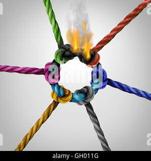 Network connection problem as a business risk concept with a group of diverse ropes connected to a circle on fire burning and breaking the link as a metaphor for connectivity trouble and linking hazard or communication failure. Stock Photo