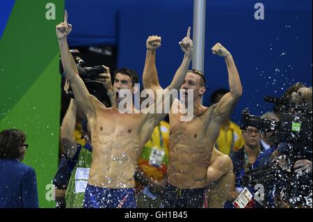 Rio De Janeiro, Brazil 7th Aug, 2016. Michael Phelps (L) from the United States of America and his teammate celebrate during the swimming final of men's 4x100m freestyle relay at the 2016 Rio Olympic Games in Rio de Janeiro, Brazil, on Aug. 7, 2016. The United States won the gold medal with 3 minutes 9.92 seconds.?Xinhua/Wang Peng?(xr) Credit:  Cao Can/Xinhua/Alamy Live News Stock Photo