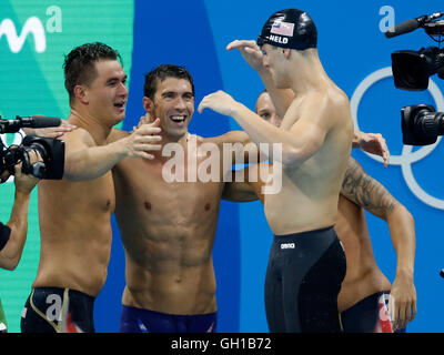 Rio De Janeiro, Brazil 7th Aug, 2016. Michael Phelps (2nd, L) from the United States of America and his teammate celebrate during the swimming final of men's 4x100m freestyle relay at the 2016 Rio Olympic Games in Rio de Janeiro, Brazil, on Aug. 7, 2016. The United States won the gold medal with 3 minutes 9.92 seconds.?Xinhua/Wang Lili?(xr) Credit:  Cao Can/Xinhua/Alamy Live News Stock Photo