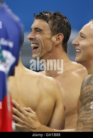 Rio De Janeiro, Brazil 7th Aug, 2016. Michael Phelps from the United States of America and his teammate celebrate during the swimming final of men's 4x100m freestyle relay at the 2016 Rio Olympic Games in Rio de Janeiro, Brazil, on Aug. 7, 2016. The United States won the gold medal with 3 minutes 9.92 seconds.?Xinhua/Ding Xu?(xr) Credit:  Cao Can/Xinhua/Alamy Live News Stock Photo