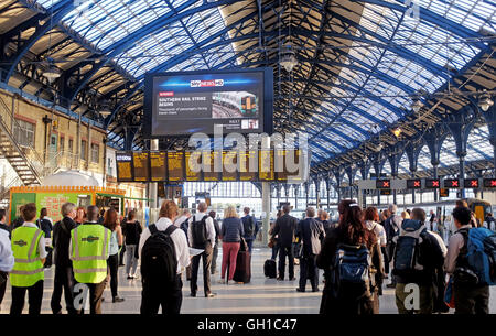 Brighton Sussex UK 8th August 2016 - Commuters can read all about it on the giant screen in Brighton Station as members of the RMT Union begin their five day strike over a dispute about taking conductors off the trains on Southern Rail  Credit:  Simon Dack/Alamy Live News Stock Photo