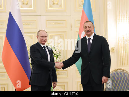 Baku, Azerbaijan. 8th Aug, 2016. Russian President Vladimir Putin (L) meets with Azerbaijani President Ilham Aliyev in Baku, Azerbaijan, on Aug. 8, 2016. Putin arrived here on Monday for a trilateral meeting with Azerbaijani President Ilham Aliyev and Iranian President Hassan Rouhani on issues of common interests. Credit:  AZERTAC/Xinhua/Alamy Live News Stock Photo