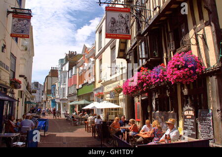 The popular street George Street with Ye Olde Pump House Pub and colourful houses, Hastings, Sussex, Great Britain Stock Photo