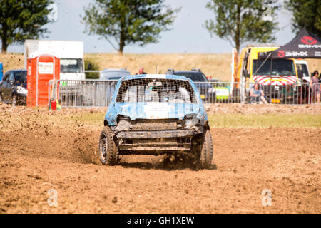 stock cars racing on a dirt track Stock Photo