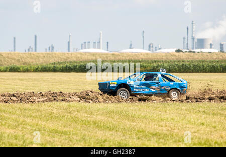 stock cars racing on a dirt track Stock Photo