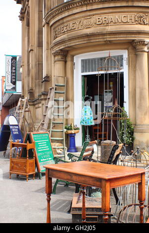 Items on sale outside Heeley Bank Antiques Centre in Sheffield's Antique Quarter, South Yorkshire, UK - August 2016 Stock Photo