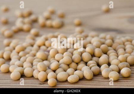 closeup to soya beans on wooden background Stock Photo