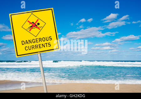 Dangerous currents sign on a beach Stock Photo