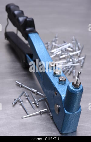 Hand rivet tool isolated on white background Stock Photo - Alamy