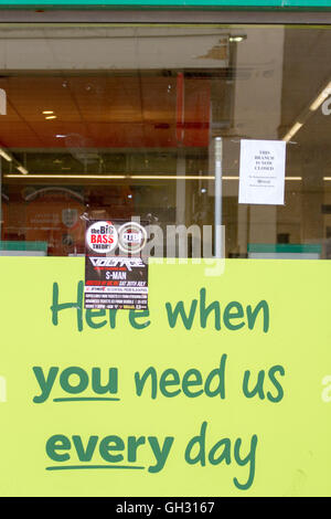 'Here when you need us every day' shop window sign with a 'Closed Down' sign above, Blackpool, Lancashire, UK. Stock Photo