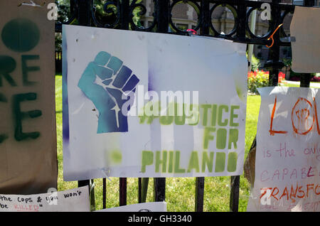 Clenched fist poster in front of governor mansion demanding justice for police killing of Phil Castle. St Paul Minnesota MN USA Stock Photo