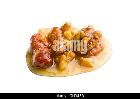 Honey and nuts isolated on white background. Stock Photo