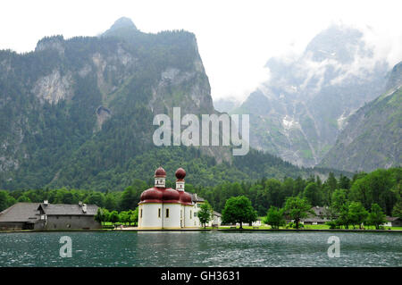 geography / travel, Germany, Bavaria, pilgrimage church St. Bartholomae from the 12th century in front of the east wall of the Watzmann (peak), Koenigssee, Berchtesgaden National Park Berchtesgaden, Additional-Rights-Clearance-Info-Not-Available Stock Photo