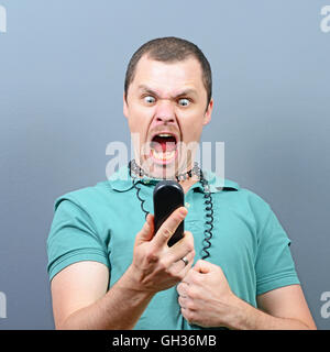 Man having unpleasant conversation on telephone Stock Photo