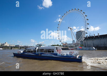 River Thames Clipper passenger ferry boat in front of the London Eye, viewed from the River Thames, London, England, UK Stock Photo