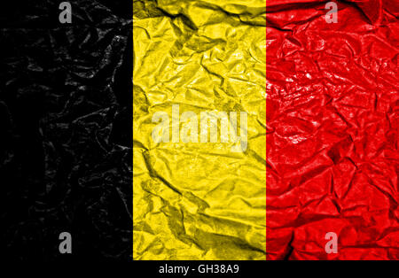 Belgium vintage flag on old crumpled paper background Stock Photo