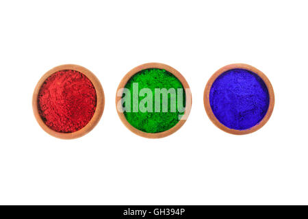 Various colored dyes in earthen bowls isolated on white. Stock Photo