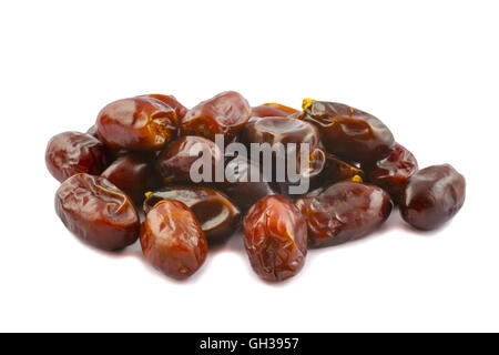 A pile of golden brown dates isolated on a white background. Stock Photo