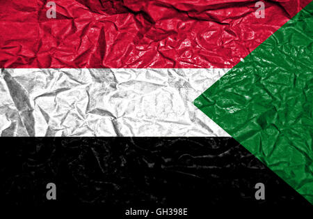 Sudan vintage flag on old crumpled paper background Stock Photo