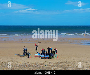 Surgers on the beach at Saltburn, North Yorkshire, England UK Stock Photo