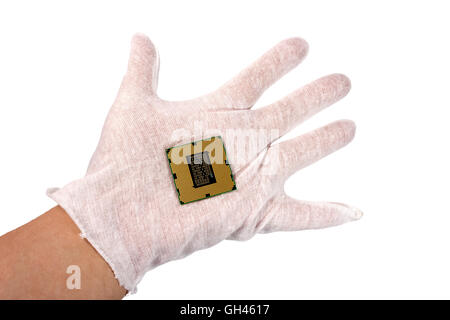 Electronic collection - CPU in hand from the bottom side isolated on white background Stock Photo
