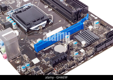 Computer motherboard isolated on white background without CPU cooler Stock Photo