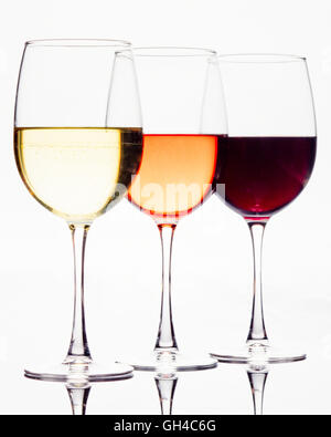 High Key Image of Three Wine Glasses Filled with White, Rose and Red Wines Stock Photo